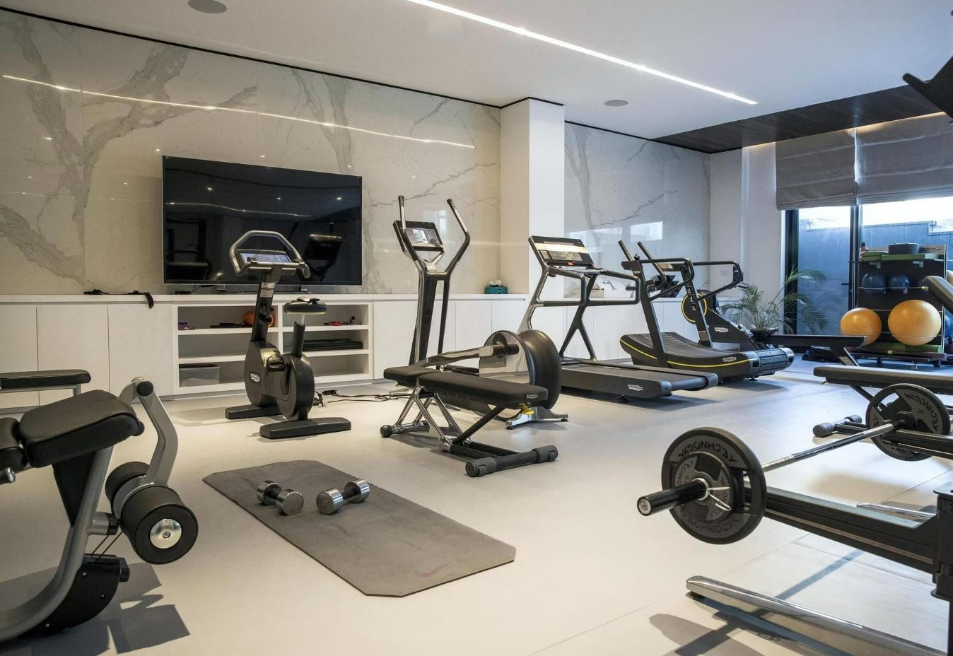 The gym accoutered with state-of-the-art equipment